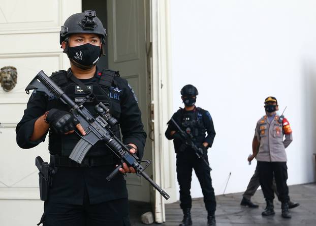 Armed police officers stand guard outside Immanuel Church during Easter celebrations amid the coronavirus disease (COVID-19) outbreak