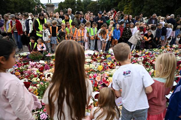 Mourners gather outside the Royal Palace, following the death of Norway's King Harald, in Oslo