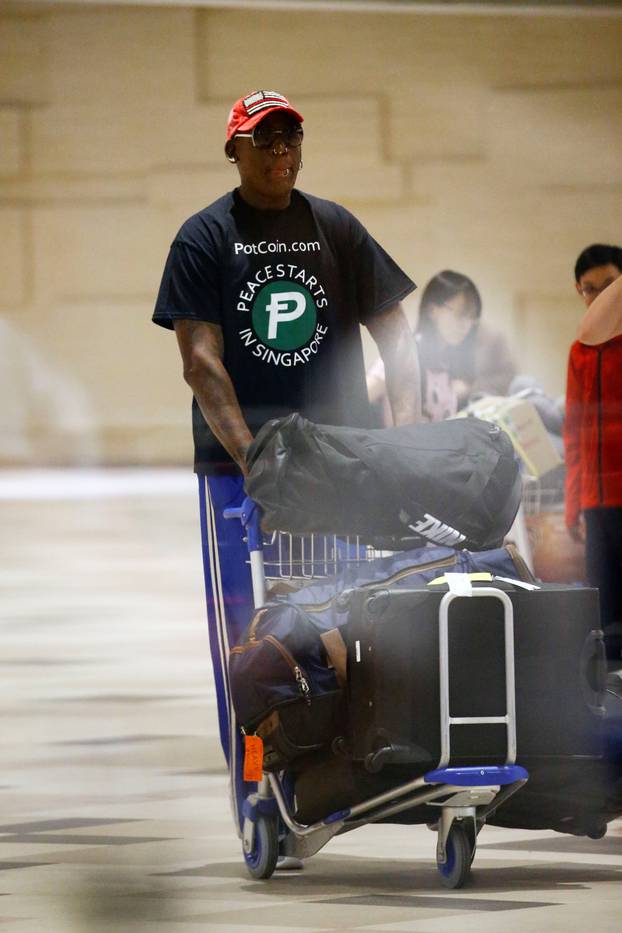 Former basketball player Dennis Rodman arrives at Changi Airport in Singapore