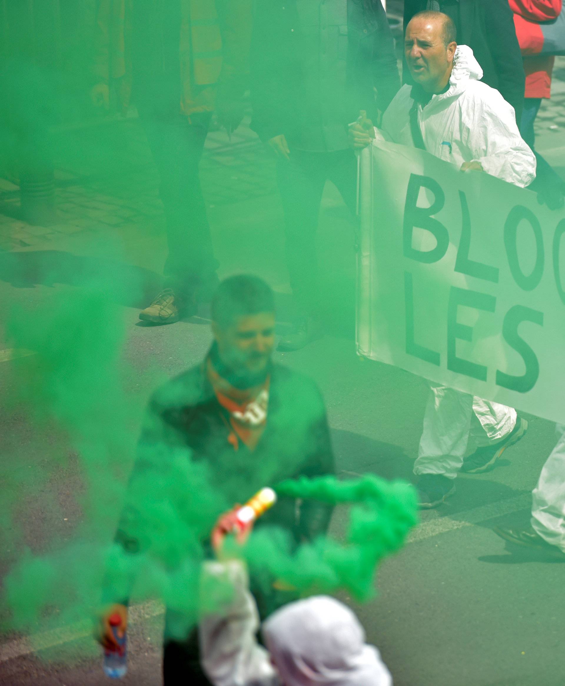 Demonstrators, protesting government reforms and cost-cutting measures, march in central Brussels