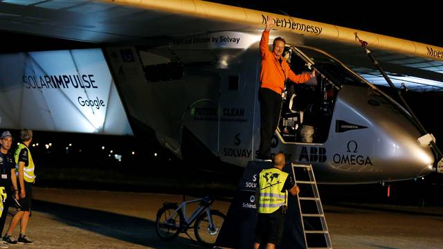 Swiss aviator of the solar-powered plane Solar Impulse 2 Borschberg waves before taking off at San Pablo airport in Seville
