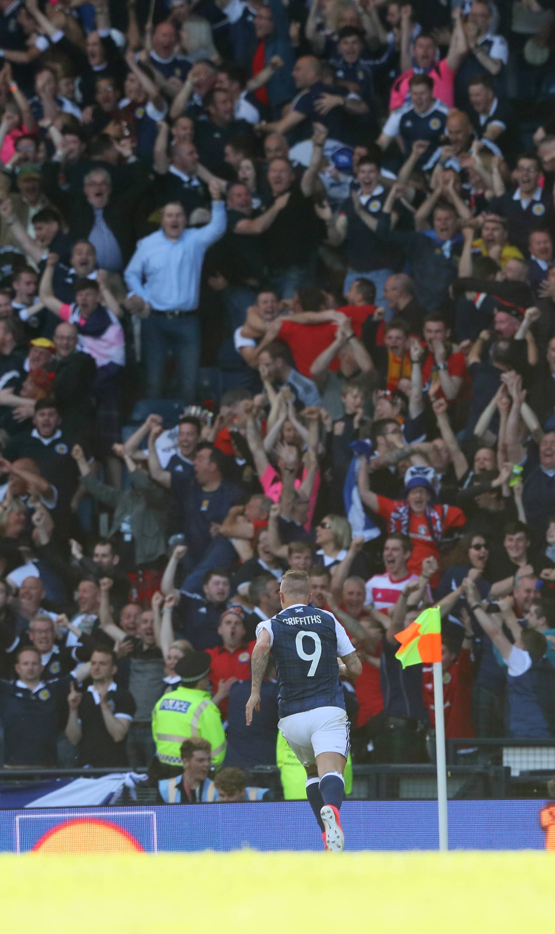 Scotland's Leigh Griffiths celebrates scoring their first goal