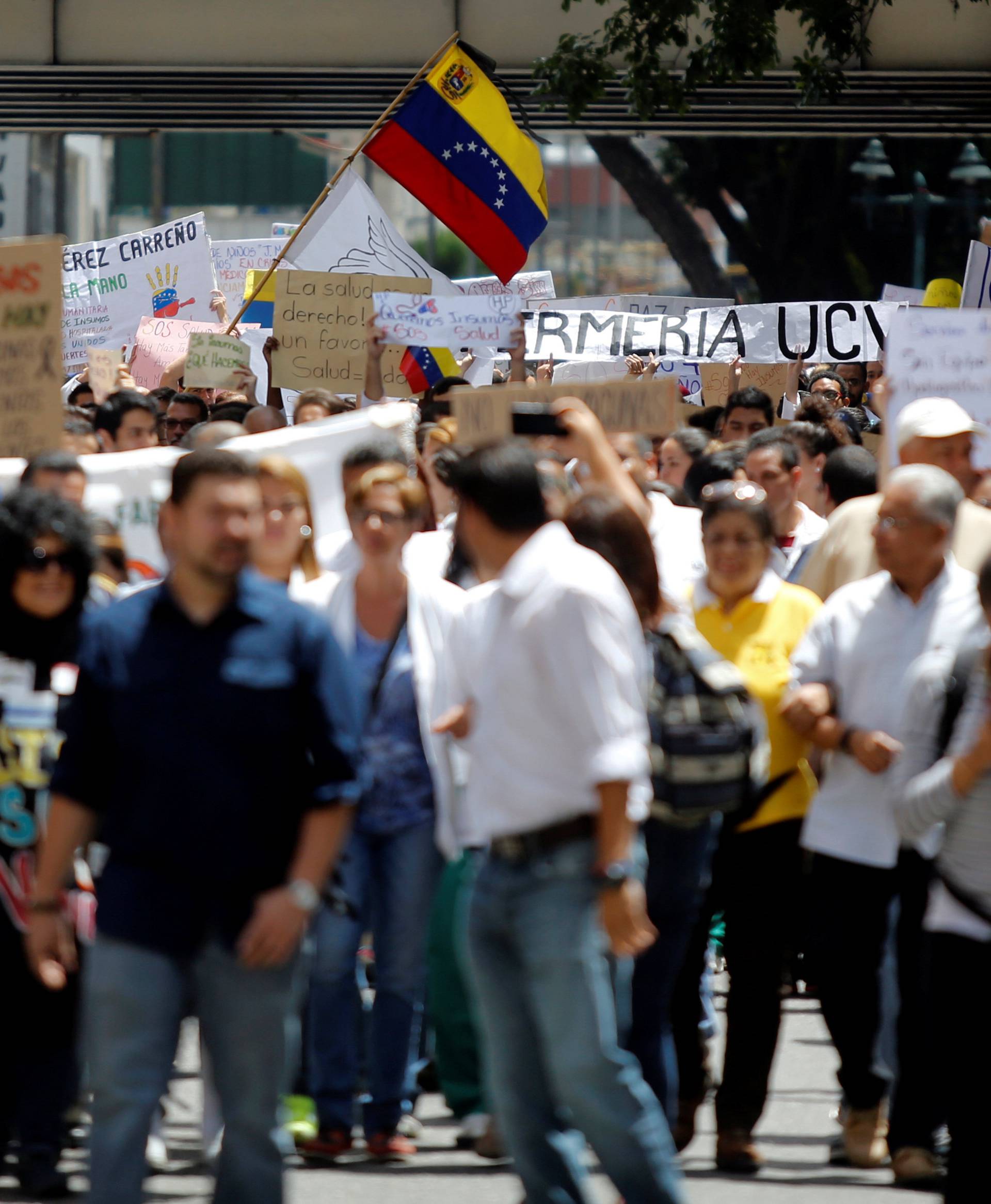 Workers of the health sector and opposition supporters take part in a protest against President Nicolas Maduro's government in Caracas