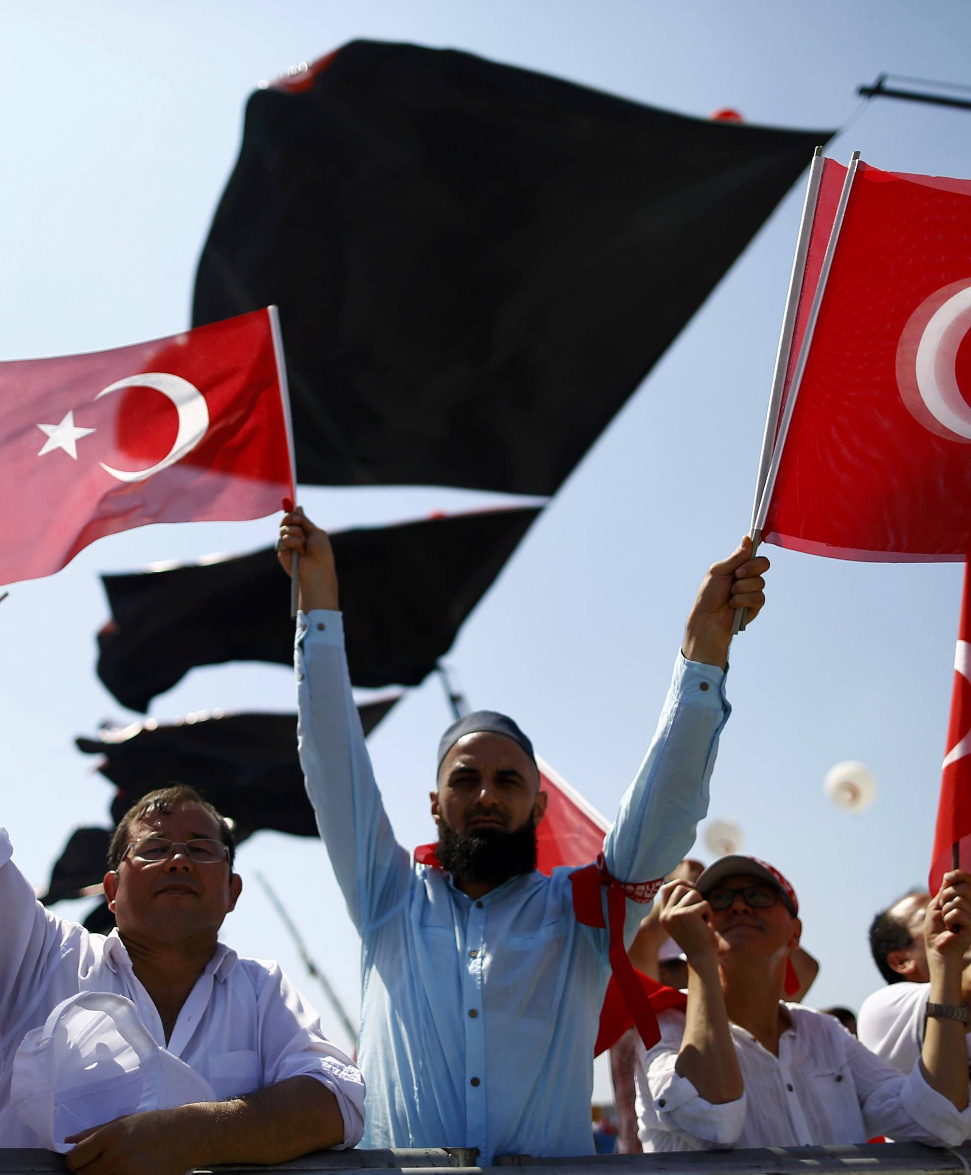 People wave Turkey's national flags ahead Democracy and Martyrs Rally in Istanbul