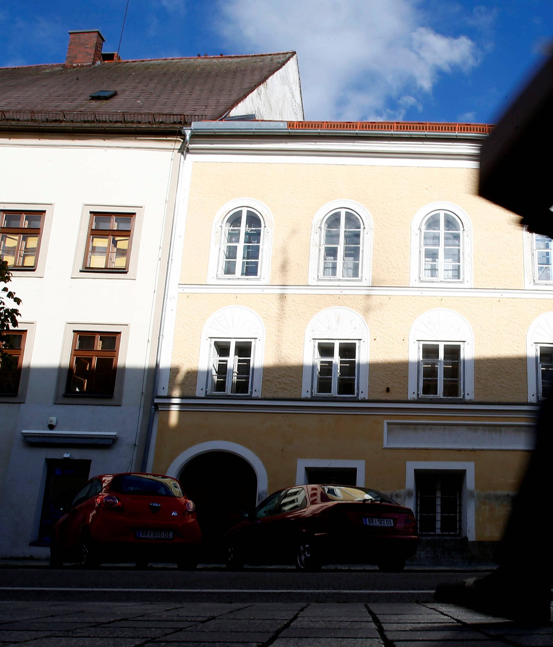 Person passes house in which Adolf Hitler was born in northern Austrian city of Braunau am Inn