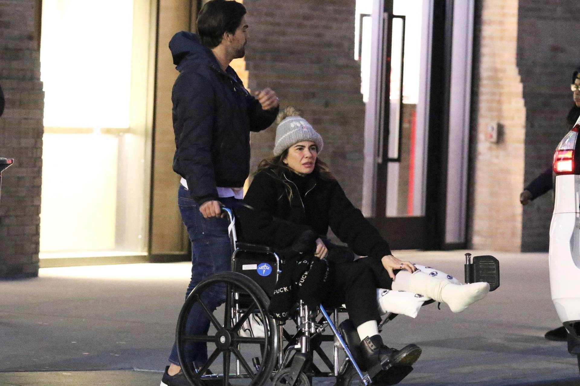 *EXCLUSIVE* Mick Jagger's ex Luciana Gimenez is seen for the first time in a wheelchair after fracturing her leg in a horror skiing accident in Aspen