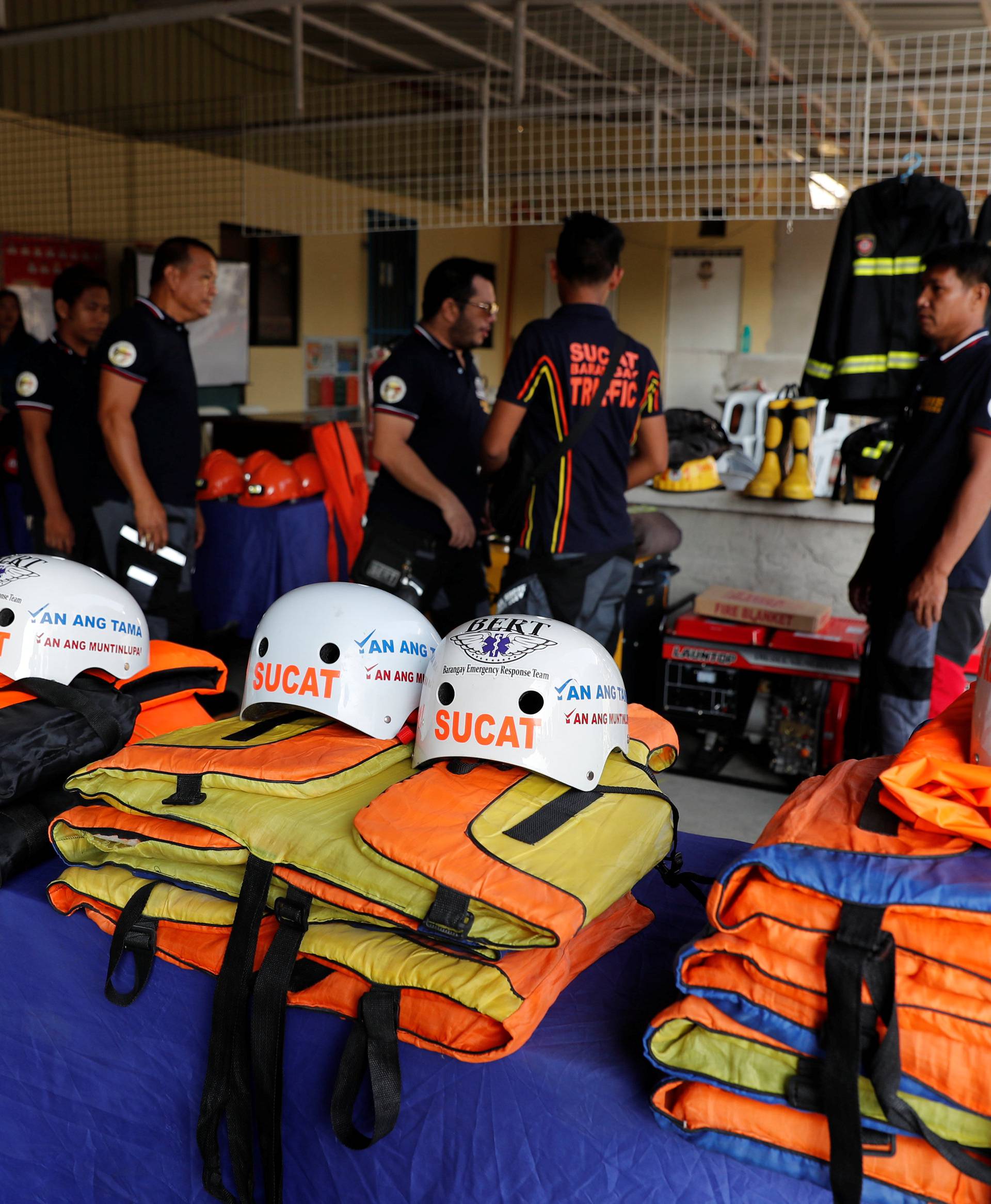 Rescuers ready their gear before Super Typhoon Mangkhut hits the main island of Luzon, in Muntinlupa