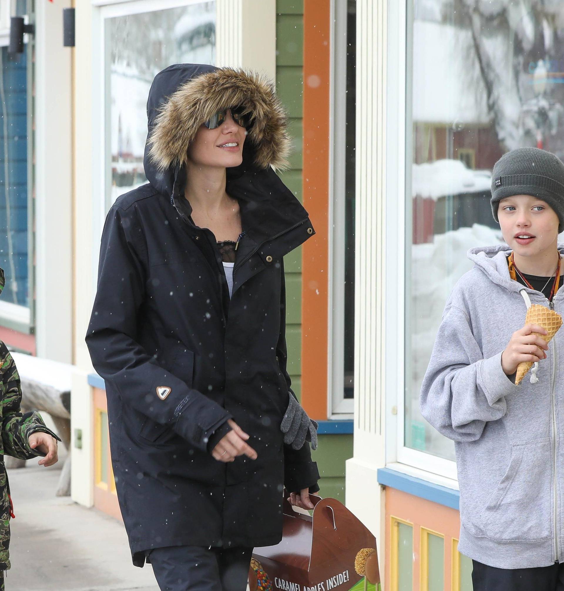 Angelina Jolie takes her kids shopping under the snow!