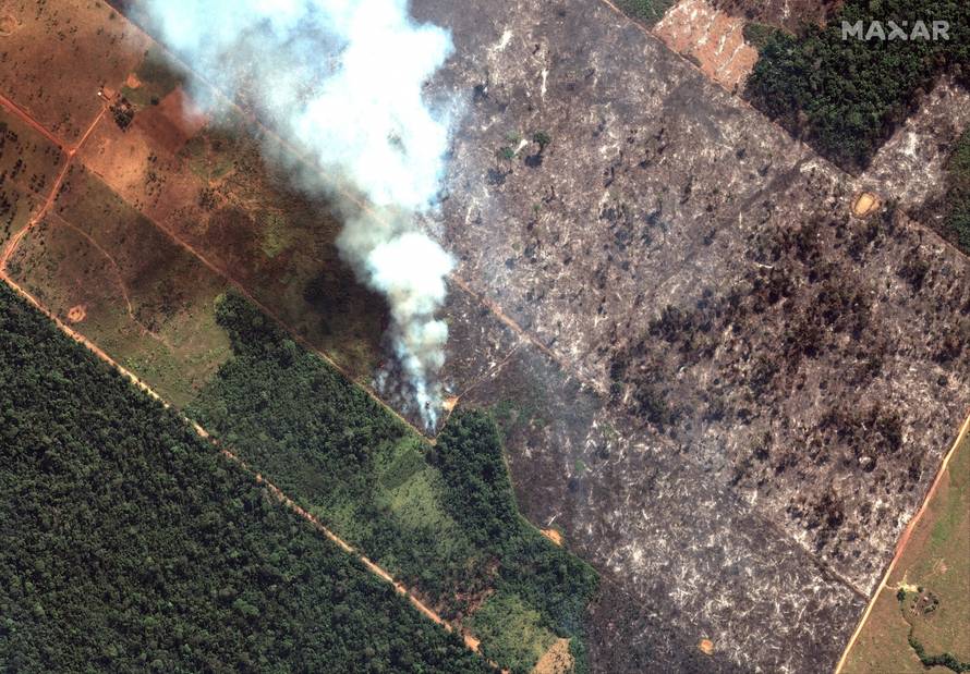 A satellite image shows smoke rising from Amazon rainforest fires in the State of Rondonia