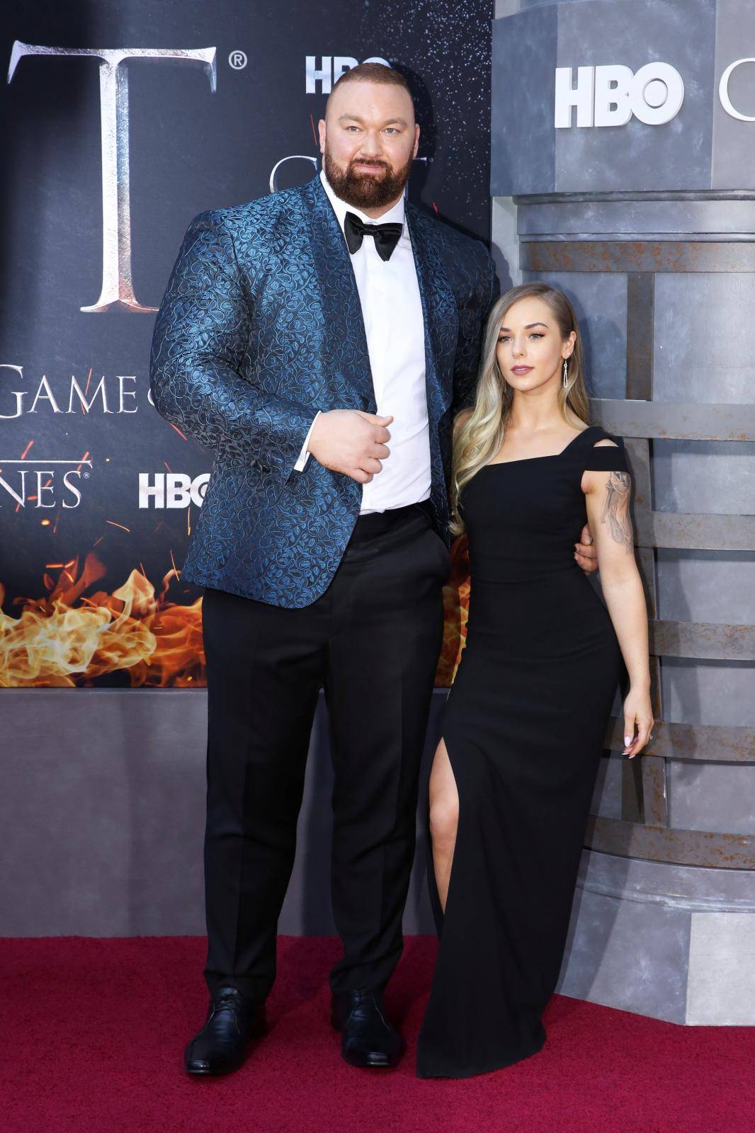 Hafthor Julius Bjornsson and Kelsey Henson arrive for the premiere of the final season of "Game of Thrones" at Radio City Music Hall in New York
