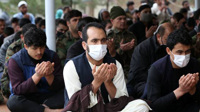 Muslims wearing protective masks attend Friday prayers at a mosque, amid concerns about the spread of coronavirus disease (COVID-19), in Kabul