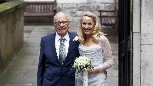 FILE PHOTO: Media Mogul Rupert Murdoch and former supermodel Jerry Hall pose for a photograph outside St Bride's church following a service to celebrate their wedding which took place on Friday, in London