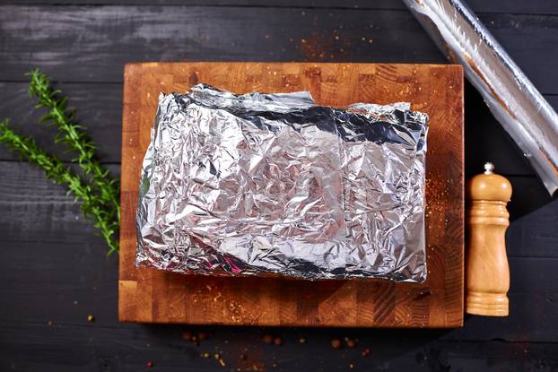 Meat in foil is ready for baking in the oven