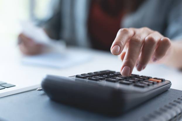 Doing,Finance,,Budgeting,And,Tax,Calculation.,Close,Up,Woman,Hand