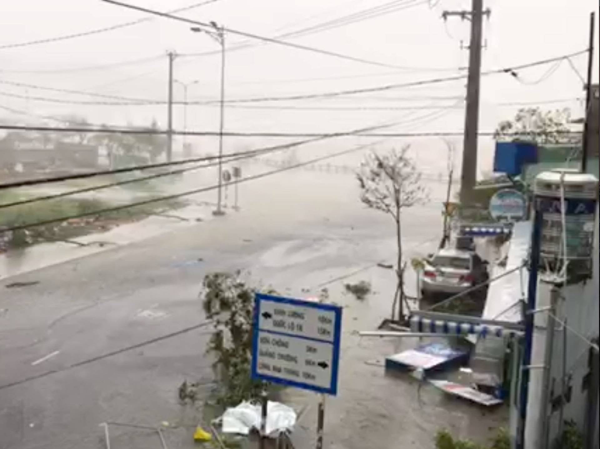 A storm batters a street in Nha Trang, as Typhoon Damrey descends on southern Vietnam