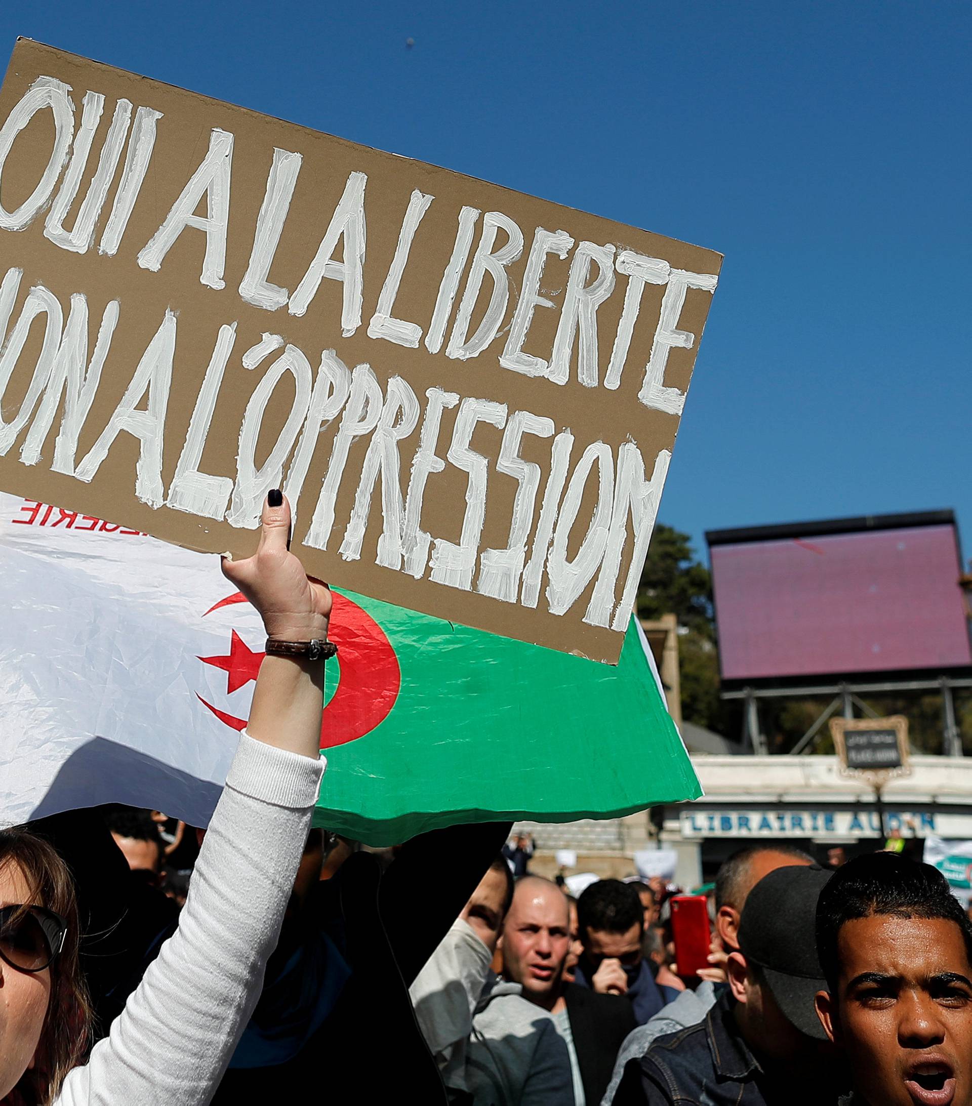 People march to protest against President Abdelaziz Bouteflika's plan to extend his 20-year rule by seeking a fifth term in April elections in Algiers