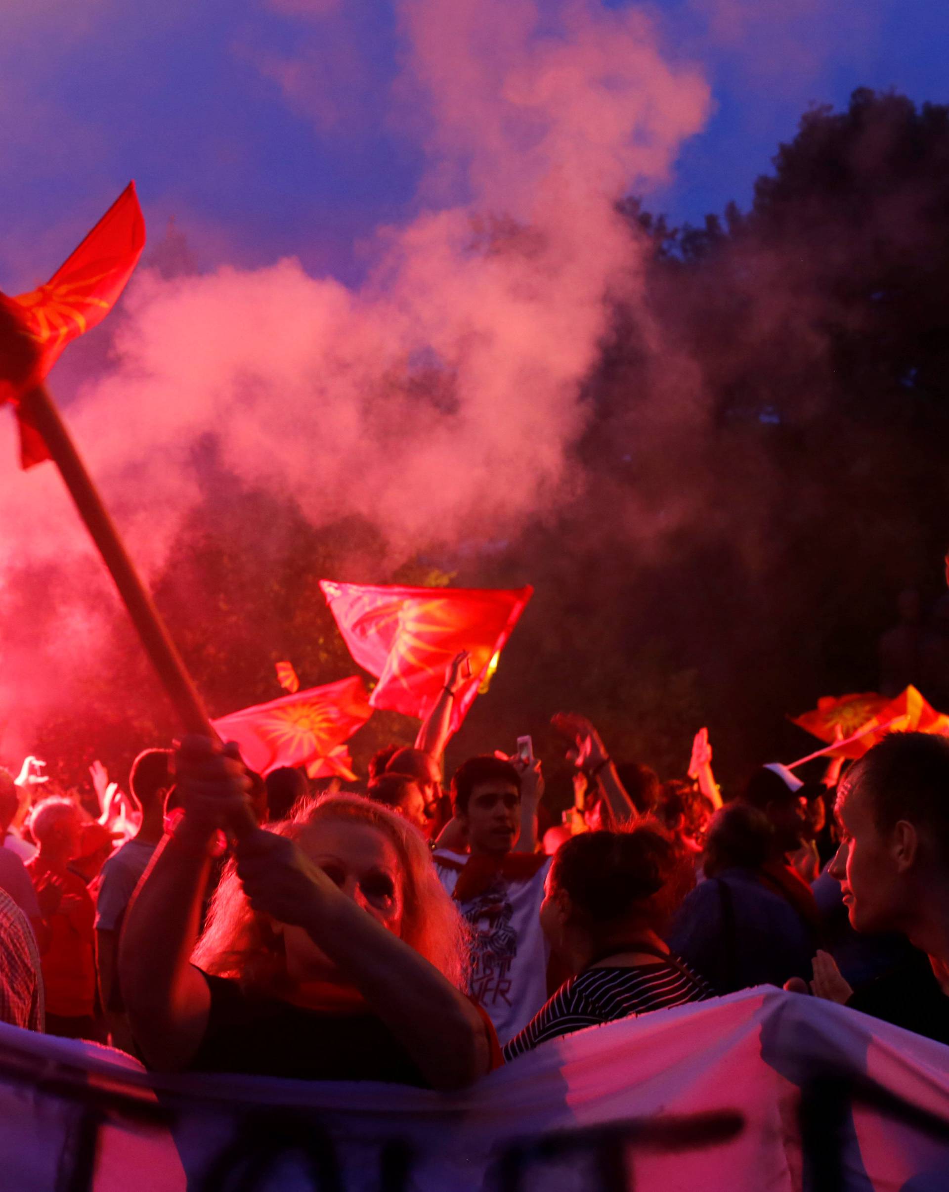 Protestors shout slogans against the change of the country's constitutional name in front of the Parliament building in Skopje