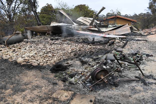 Property damaged by a fire is seen at a Sarsfield residence in East Gippsland