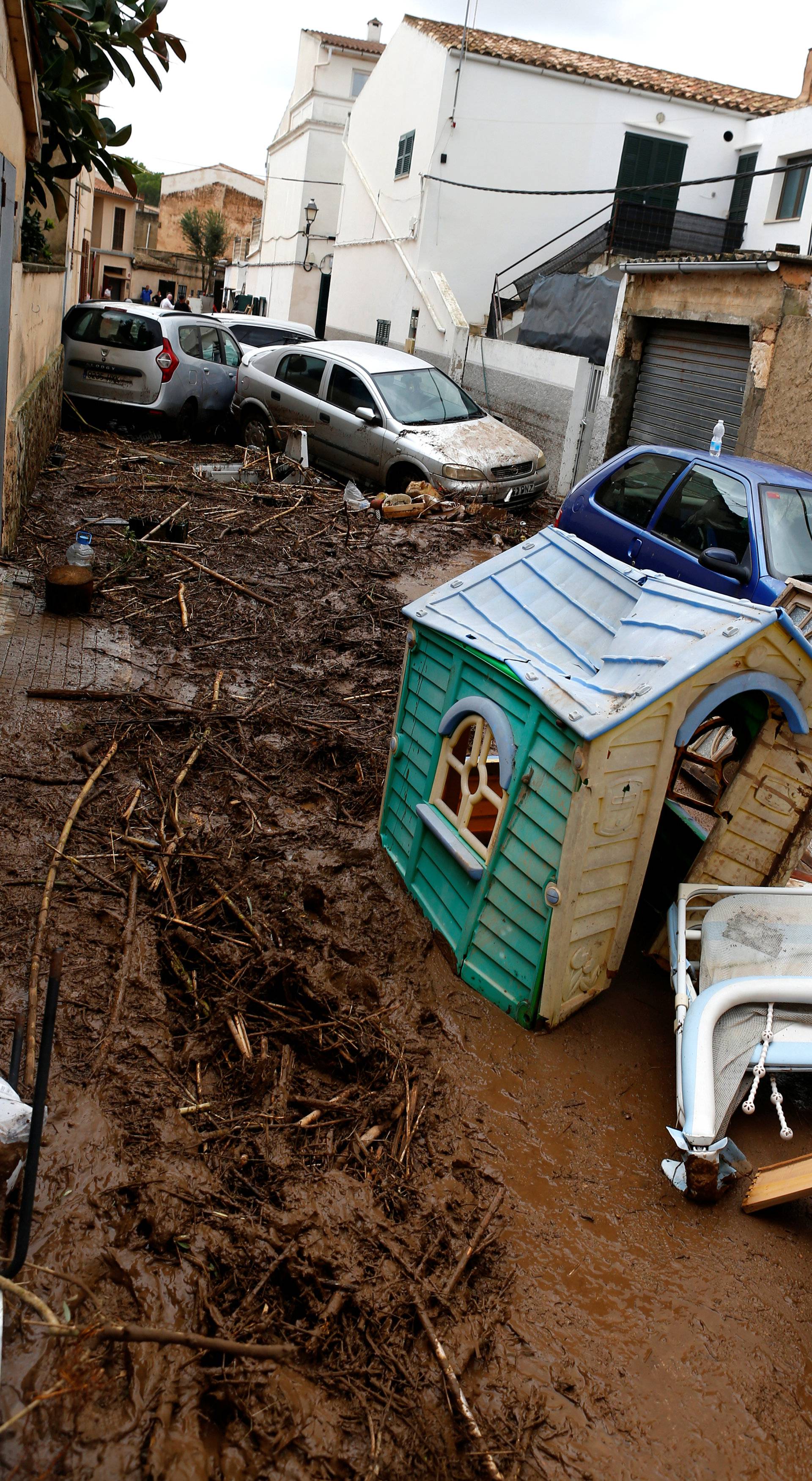 Destroyed cars are seen as heavy rain and flash floods hit Sant Llorenc de Cardassar on the island of Mallorca