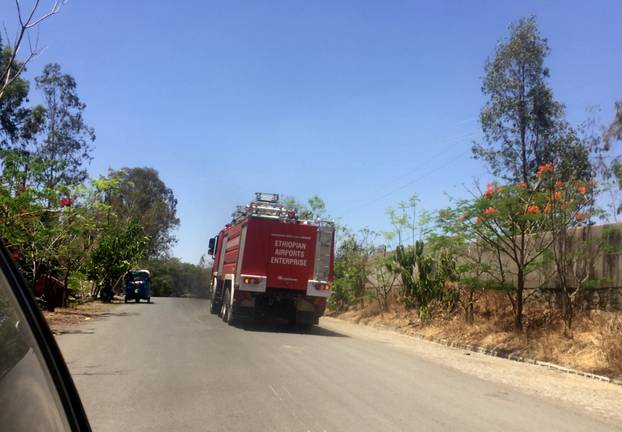 An Ethiopian Airports Enterprise fire engine drives to the scene of the Flight ET 302 plane crash, near the town of Bishoftu