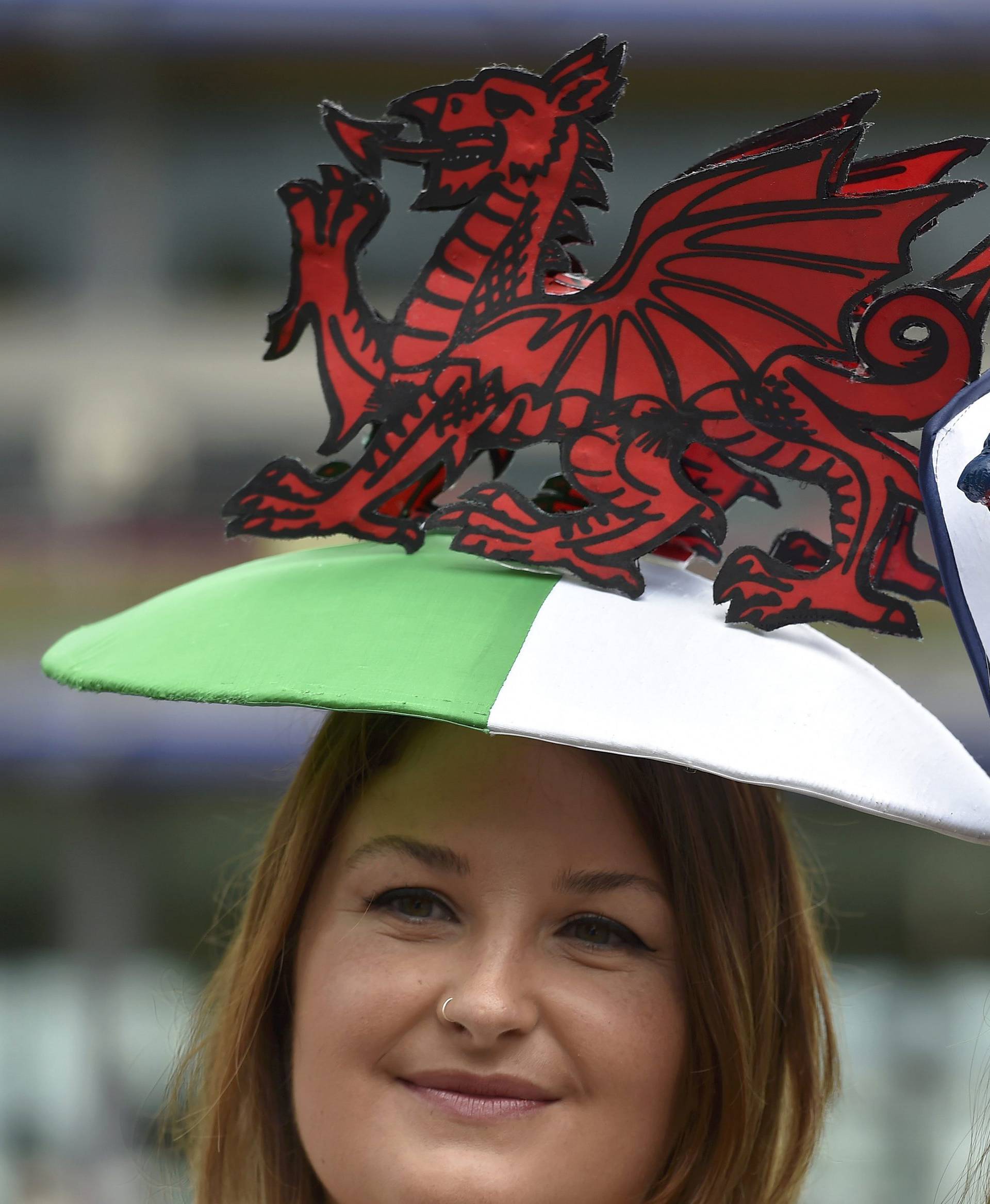 Britain Horse Racing Ladies Day Racegoers wear England and Wales themed hats