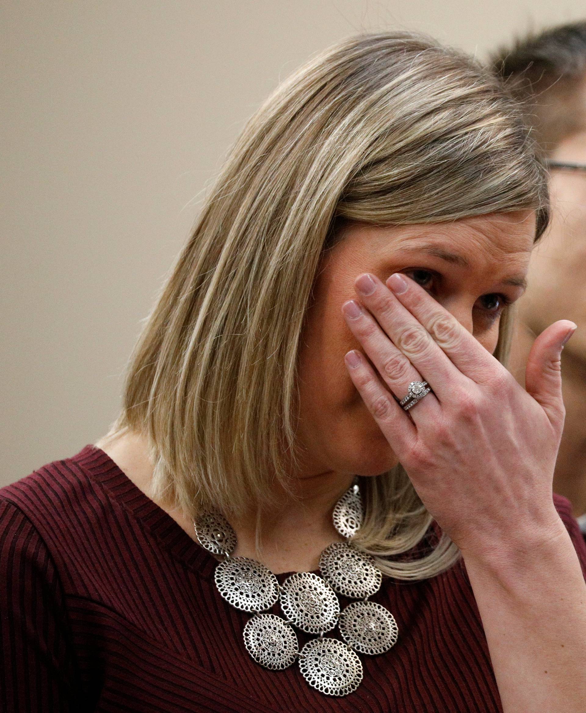 Victim Jennifer Hayes wipes tears while speaking during a sentencing hearing for Larry Nassar, a former team USA Gymnastics doctor who pleaded guilty in November 2017 to sexual assault charges, in Lansing, Michigan