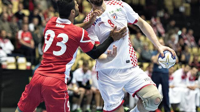 Habib Mohamed of Bahrain and Marko Kopljar of Croatia in action during their men's handball Olympic qualification match in Boxen