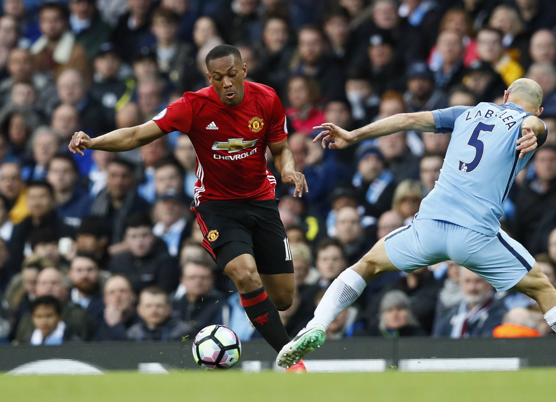 Manchester United's Anthony Martial in action with Manchester City's Pablo Zabaleta