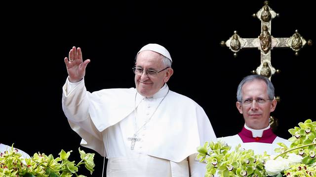 Pope Francis appears after delivering his Easter message in the Urbi et Orbi (to the city and the world) address from the balcony overlooking St. Peter's Square at the Vatican