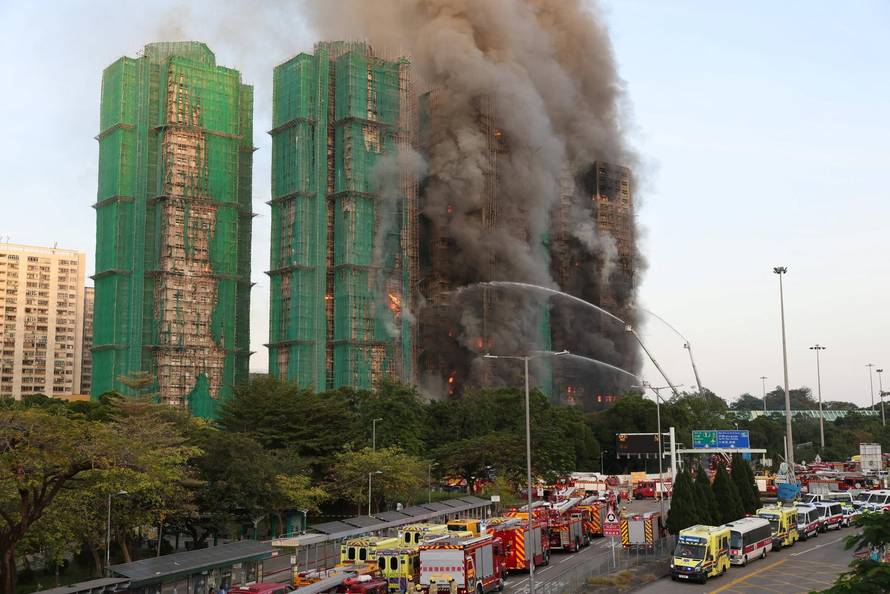 Flames engulf bamboo scaffolding across multiple buildings at Wang Fuk Court housing estate, in Tai Po