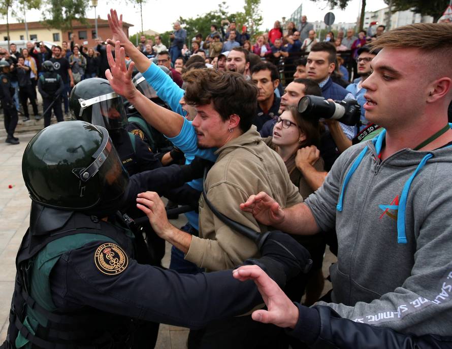 Scuffles break out with officers outside polling station for Catalonia referendum in Sant Julia de Ramis