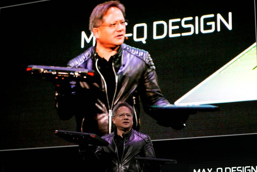 Jensen Huang, CEO of Nvidia, shows the old and new Max-Q laptops at his keynote address at CES in Las Vegas