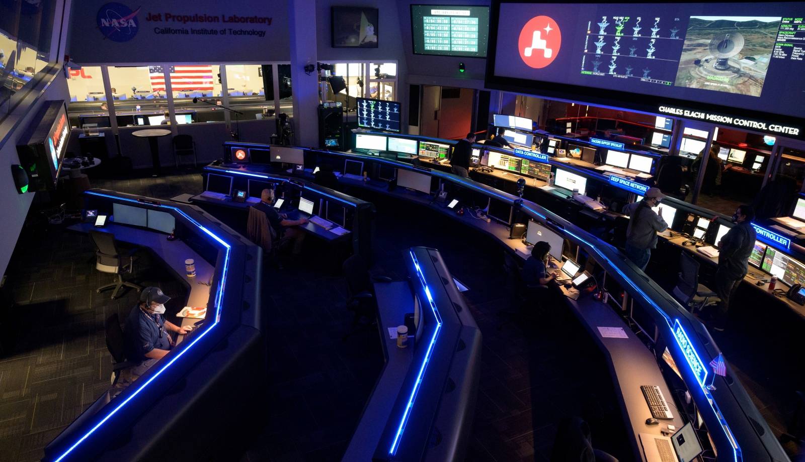 Members of NASA’s Perseverance Mars rover team study data on monitors in mission control at NASA's Jet Propulsion Laboratory