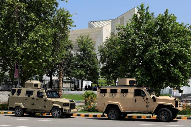 Police armoured personnel carriers are parked in front of the Supreme Court of Pakistan Islamabad