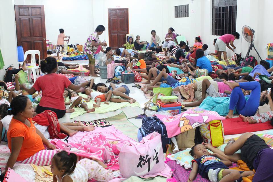 Photo by LGU Gonzaga Cagayan from social media shows people inside an evacuation centre in preparation for Typhoon Mangkhut in Cagayan