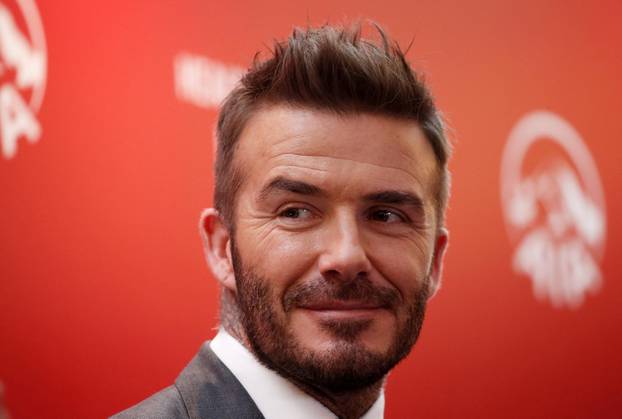 FILE PHOTO: David Beckham attends an insurance company charity event in Jakarta