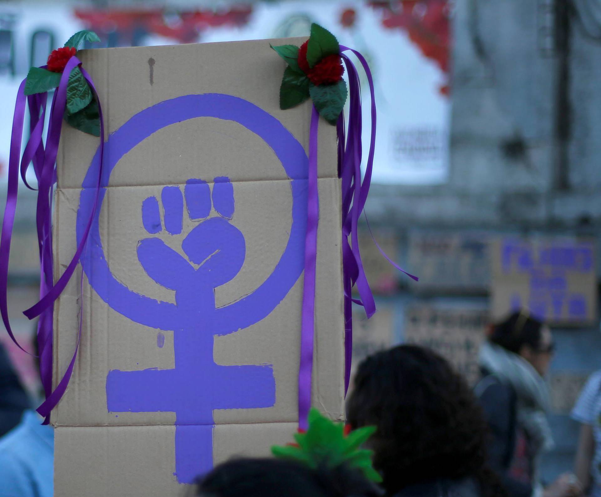 FILE PHOTO: Women attend a meeting to mark International Women's Day in downtown Lisbon