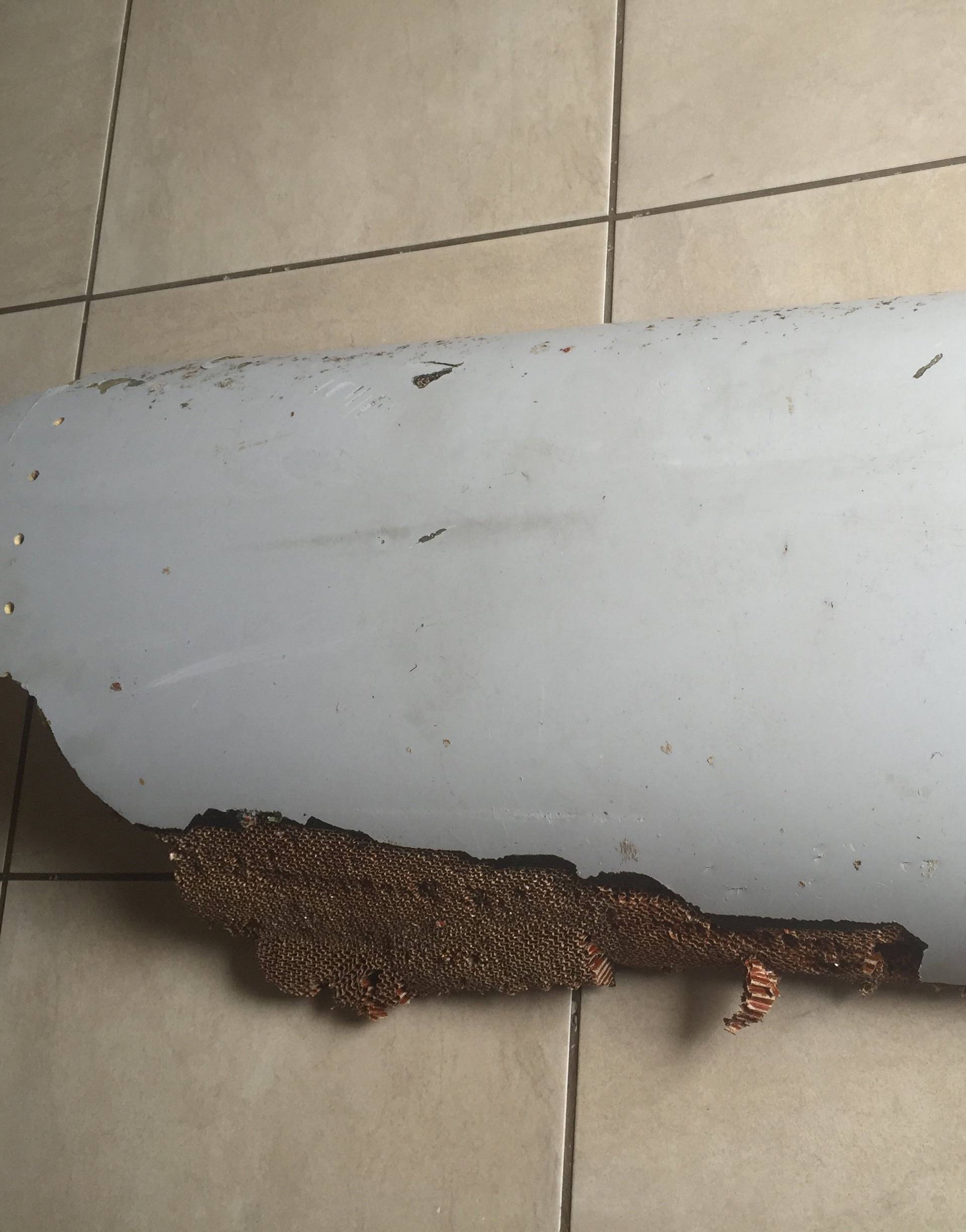 Handout photo of piece of debris found by a South African family off the Mozambique coast, which authorities will examine to see if it is from missing Malaysia Airlines flight MH370
