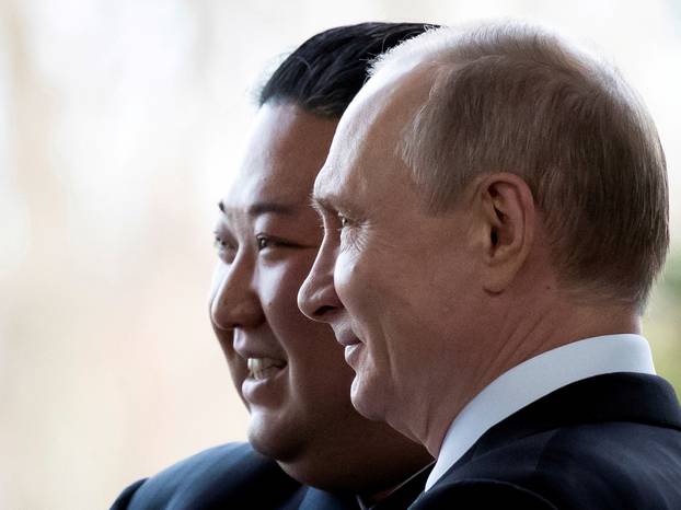 FILE PHOTO: Russian President Vladimir Putin and North Korea's leader Kim Jong Un pose for a photo during their meeting in Vladivostok