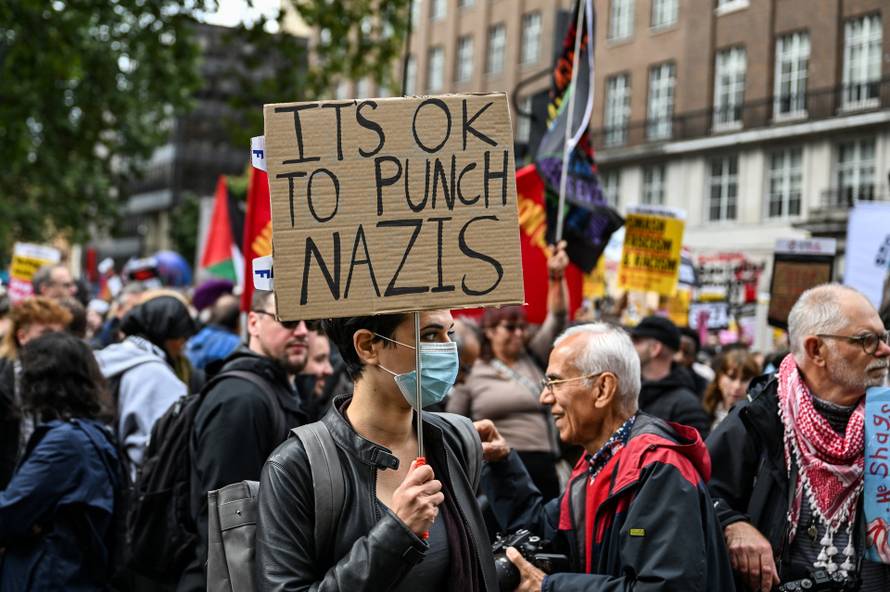 Anti-racism protesters gather to counter anti-immigration rally led by Tommy Robinson, in London