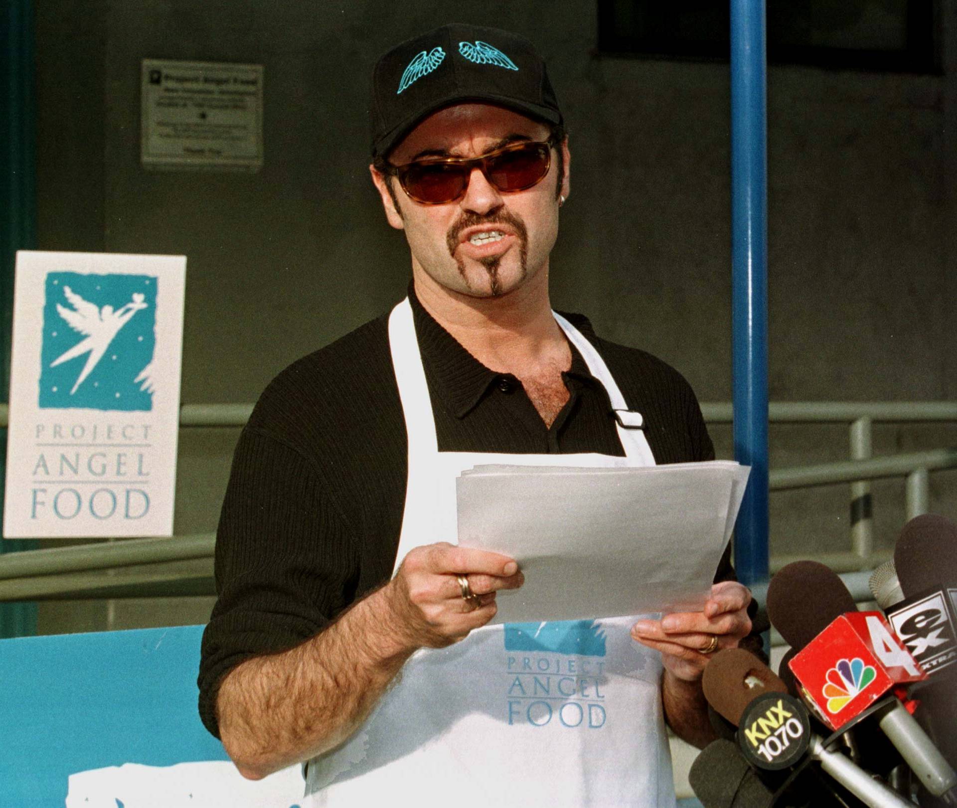 FILE PHOTO: Singer George Michael reads a statement at the headquarters of Project Angel Food in Los Angeles