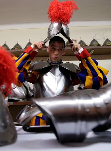 New recruit of the Vaticanâs elite Swiss Guard prepares for the swearing-in ceremony at the Vatican