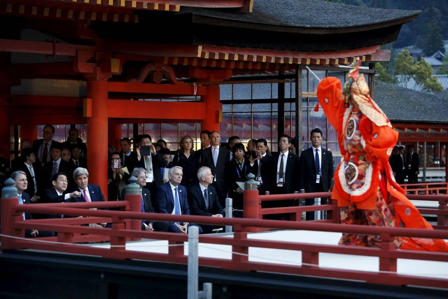 Kerry talks to Kishida during a ceremonial dance at the Itsukushima Shrine, as they and Hammond, Gentiloni, Ayrault and Dion take a cultural break from their G7 foreign minister meetings in nearby Hiroshima to visit Miyajima Island