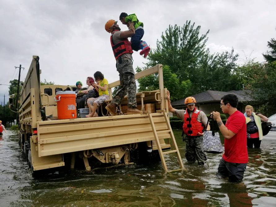 Handout photo of Texas National Guard soldiers aiding residents in heavily flooded areas from the storms of Hurricane Harvey in Houston