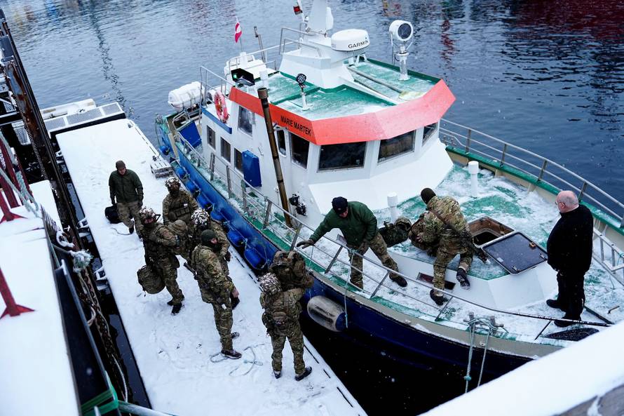 Danish soldiers disembark at the port in Nuuk