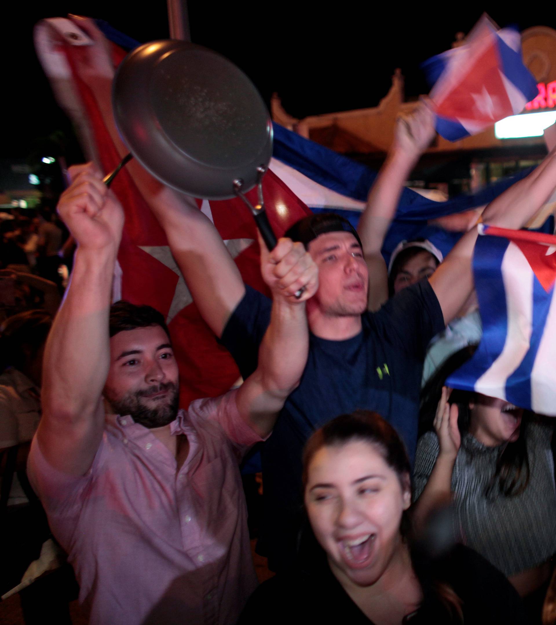 People celebrate after the announcement of the death of Cuban revolutionary leader Fidel Castro in the Little Havana district of Miami