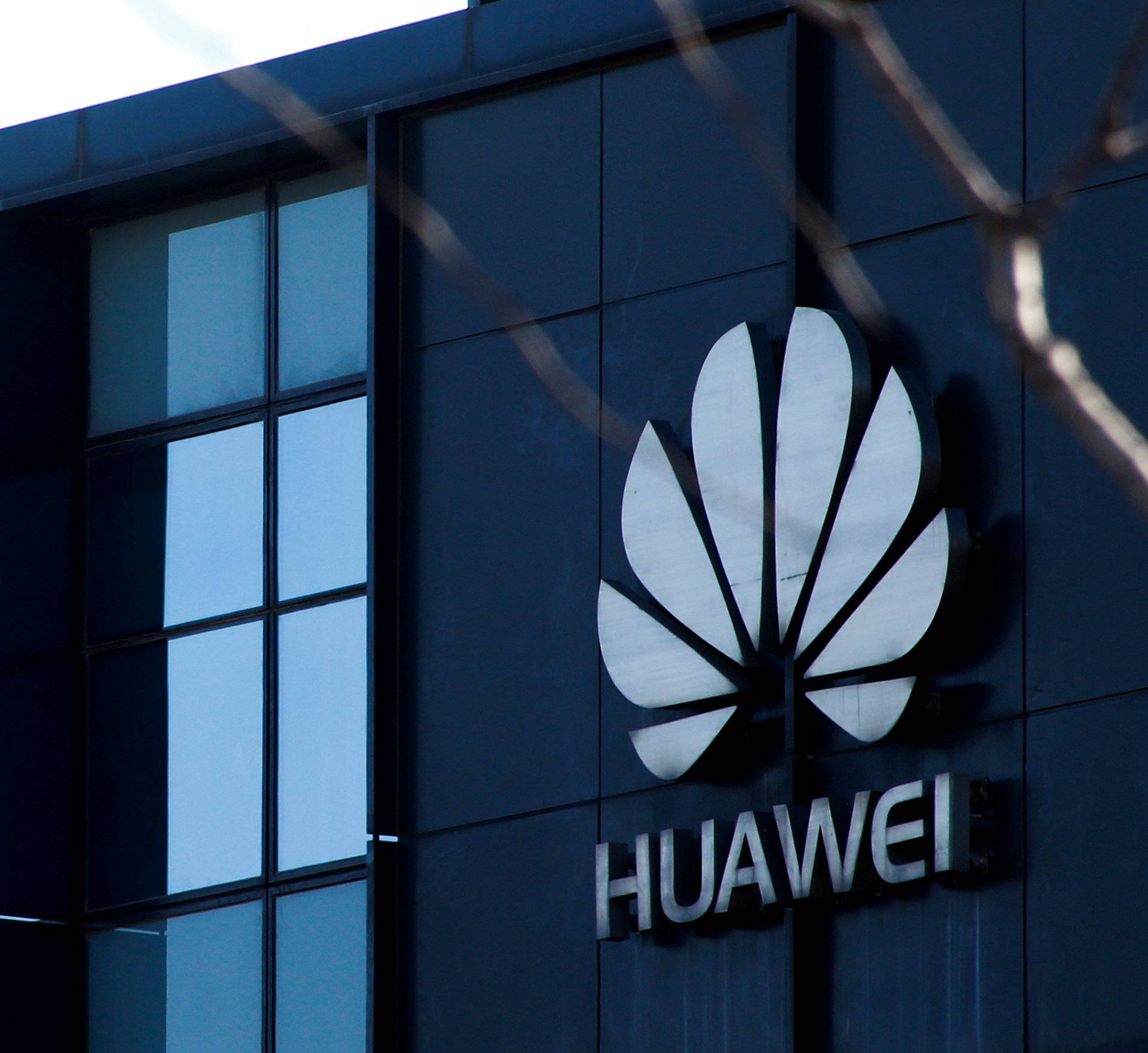 FILE PHOTO: Huawei's company logo is seen at an office in Beijing