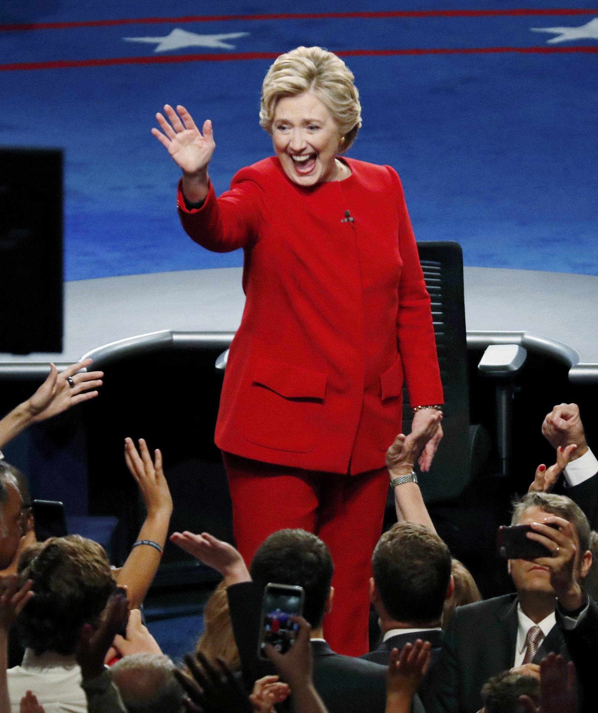 Democratic U.S. presidential nominee Hillary Clinton waves after the first presidential debate against Republican U.S. presidential nominee Donald Trump at Hofstra University in Hempstead
