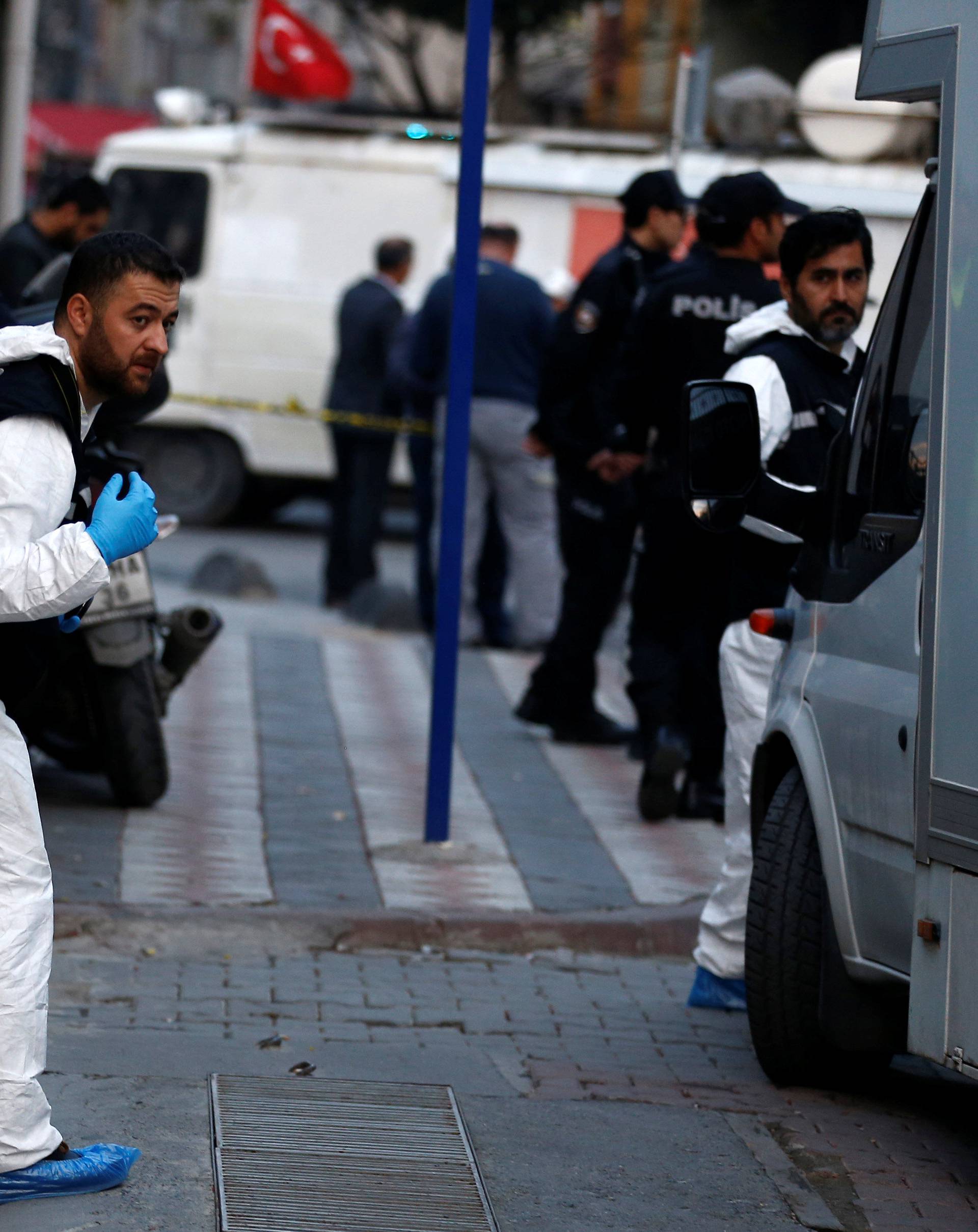 Turkish police and forensic experts are seen outside a car park where a vehicle belonging to Saudi Arabia's consulate was found, in Istanbul