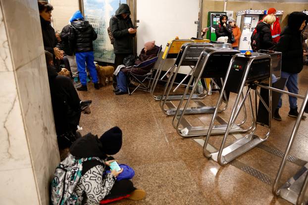 People take shelter during a Russian missile and drone attack, in Kyiv